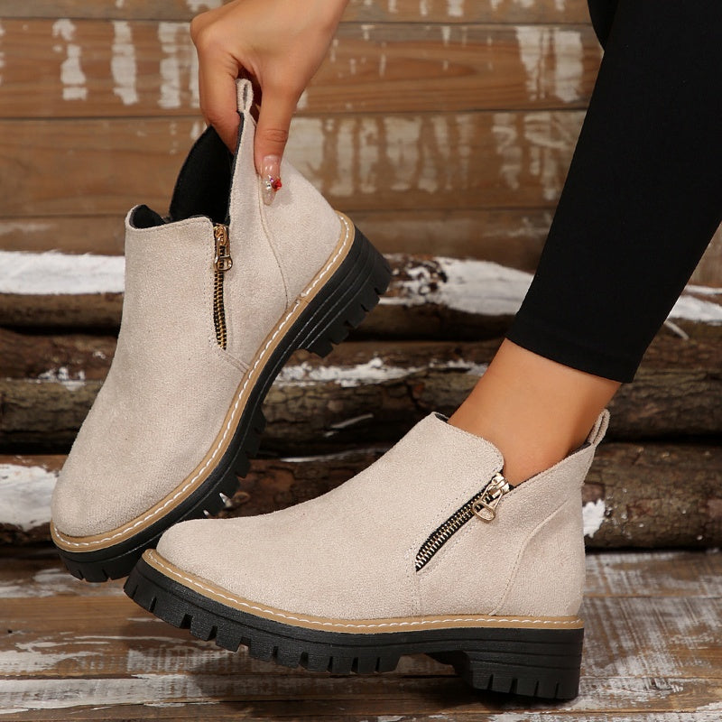 ZipStryde Sleek Zip Ankle Boots - diagonal view highlighting zipper and round toe design