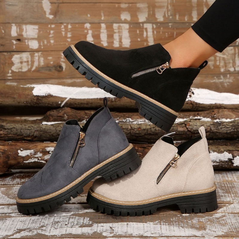 ZipStryde Sleek Zip Ankle Boots - close-up of boots worn on feet in casual setting